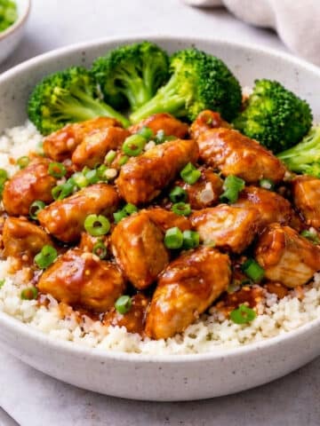 bowl of teriyaki chicken over cauliflower rice